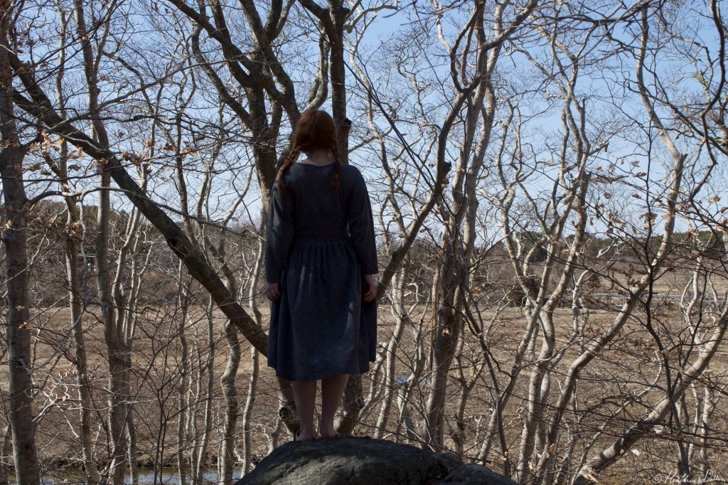 Photograph woman on rock