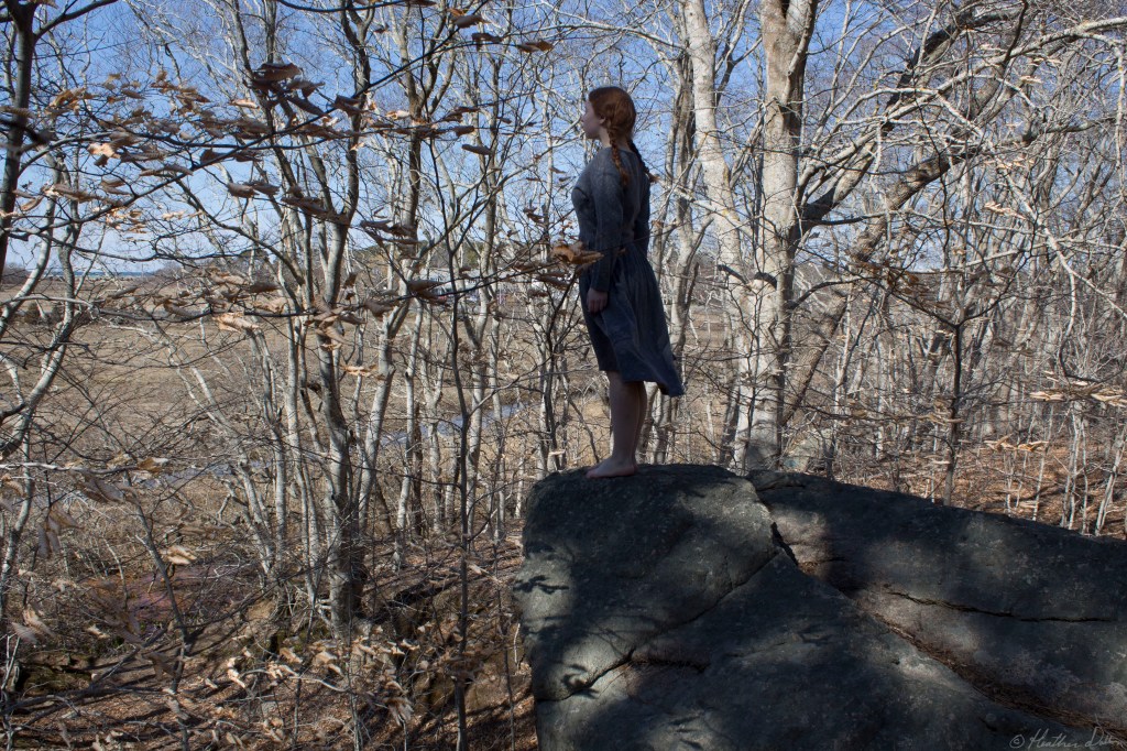 Photograph woman on cliff