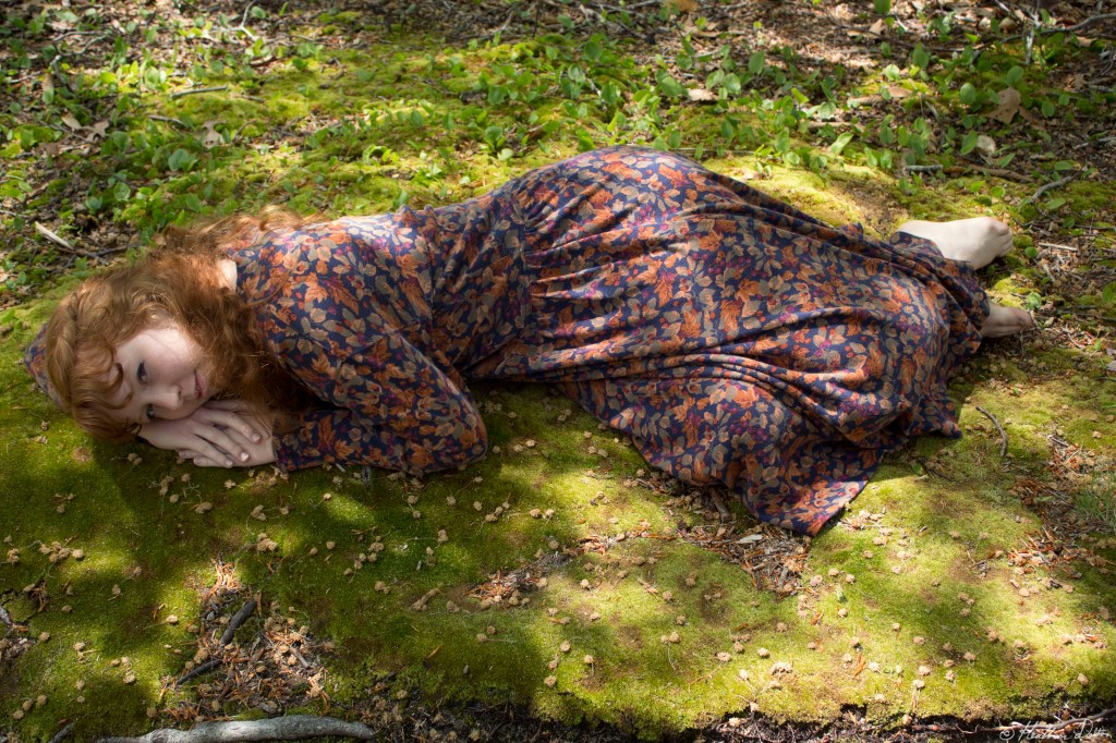 Mary lying on moss photo
