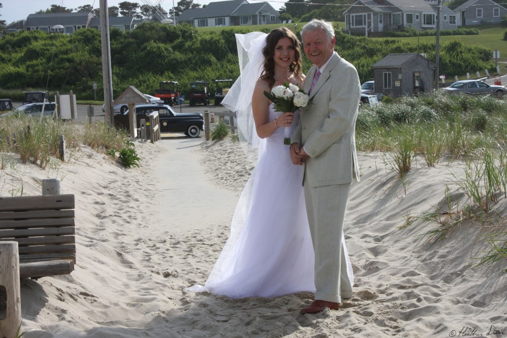 Bride and man walking down isle