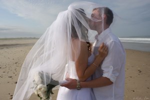 Wedding kiss under veil